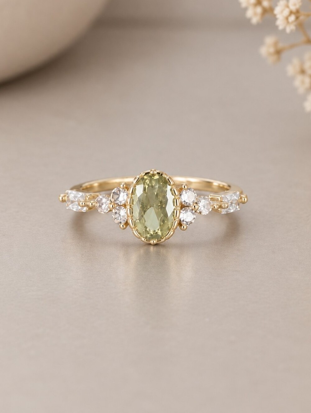Gold Ring with Oval Pale Green Gemstone and Clear Accent Stones